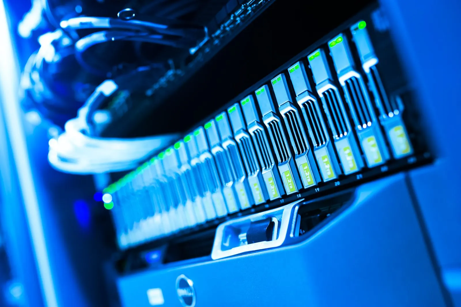 Close-up of illuminated server and computer hardware in a data center